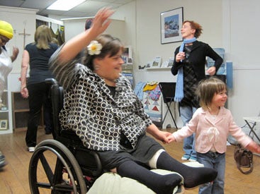 students dancing in wheelchairs